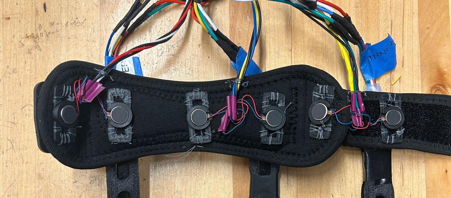 KICD mechanical design showing flex sensor enclosures and ERM motor mounting